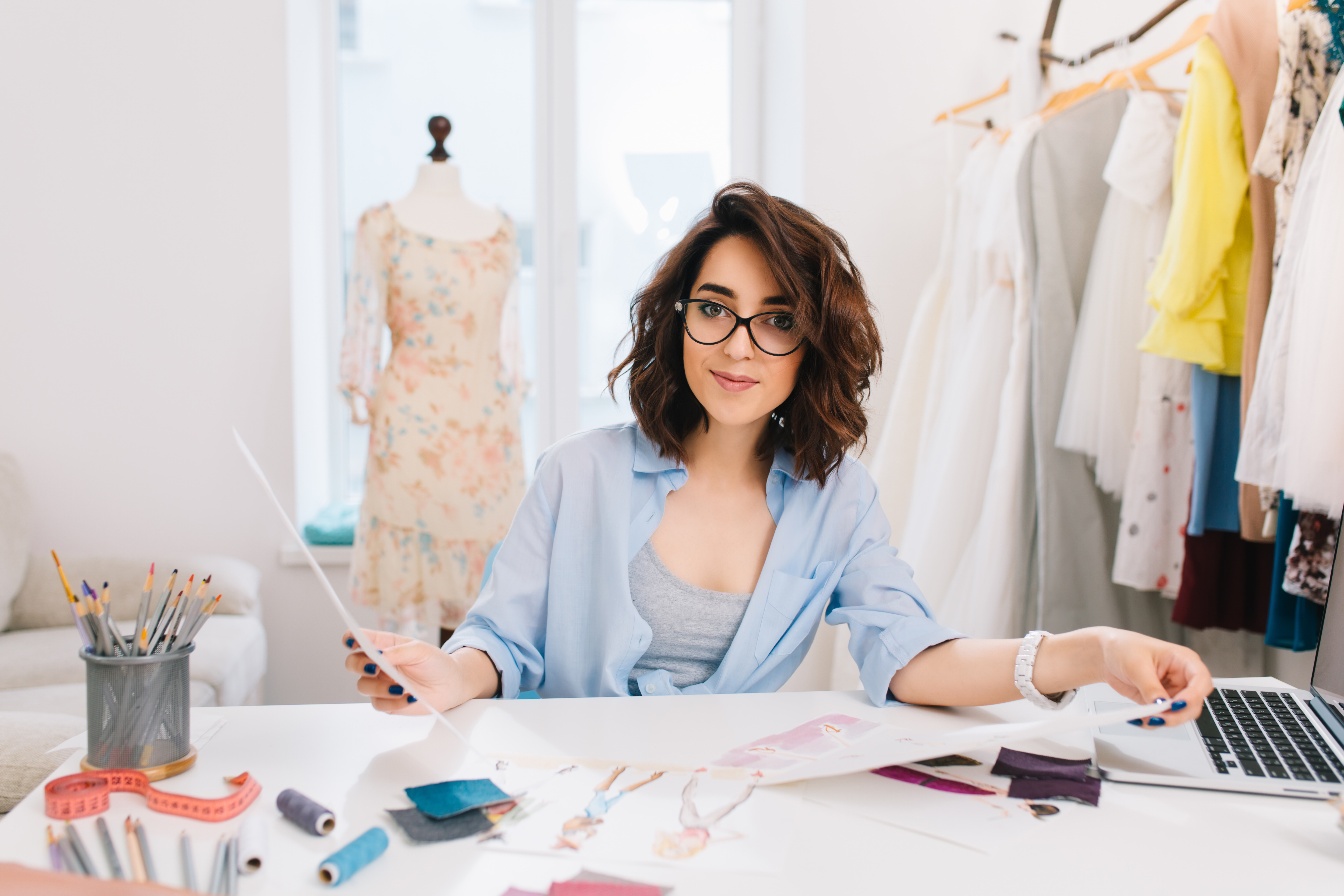 Designer reviewing fashion sketches