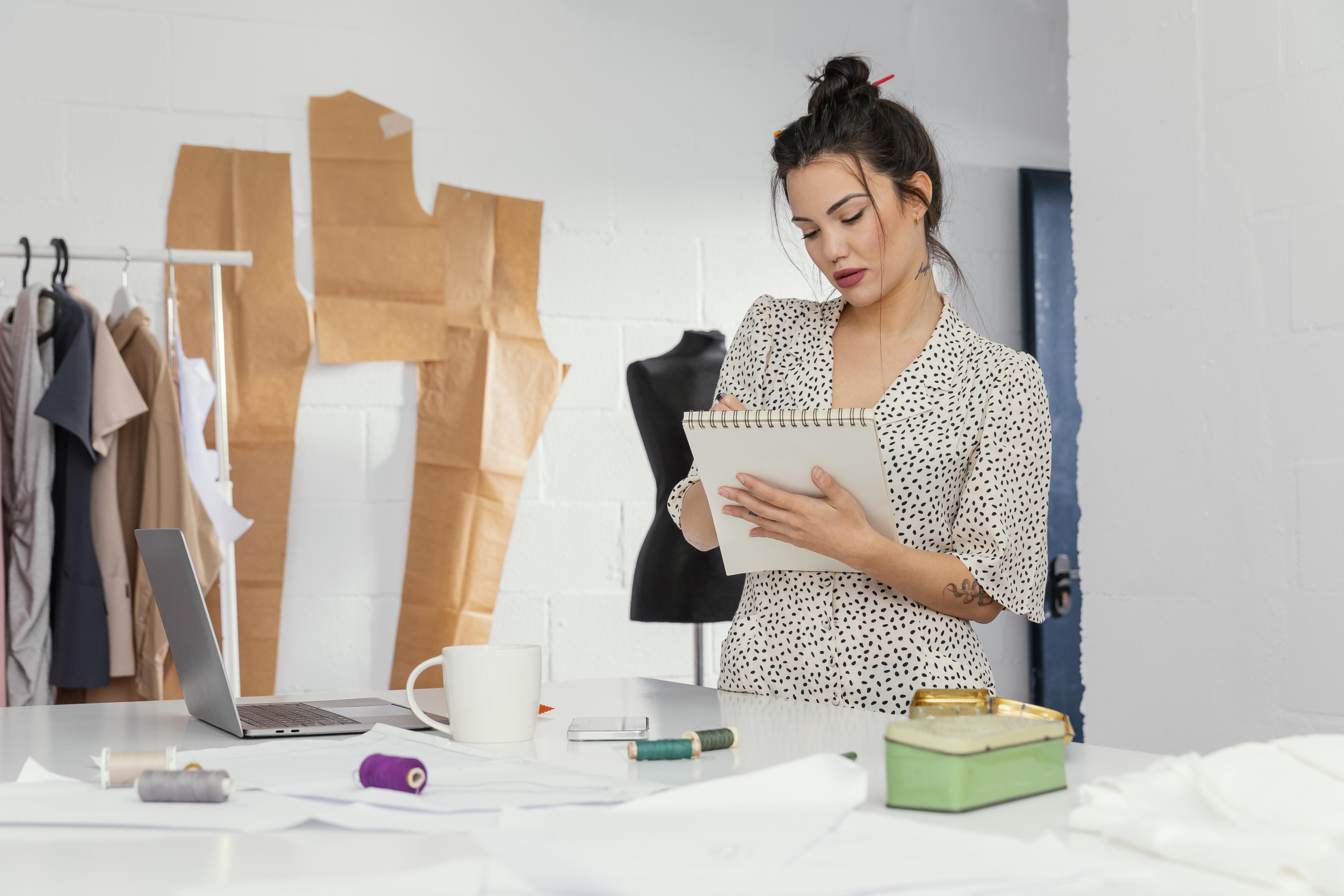 Fashion designer sketching and designing patterns